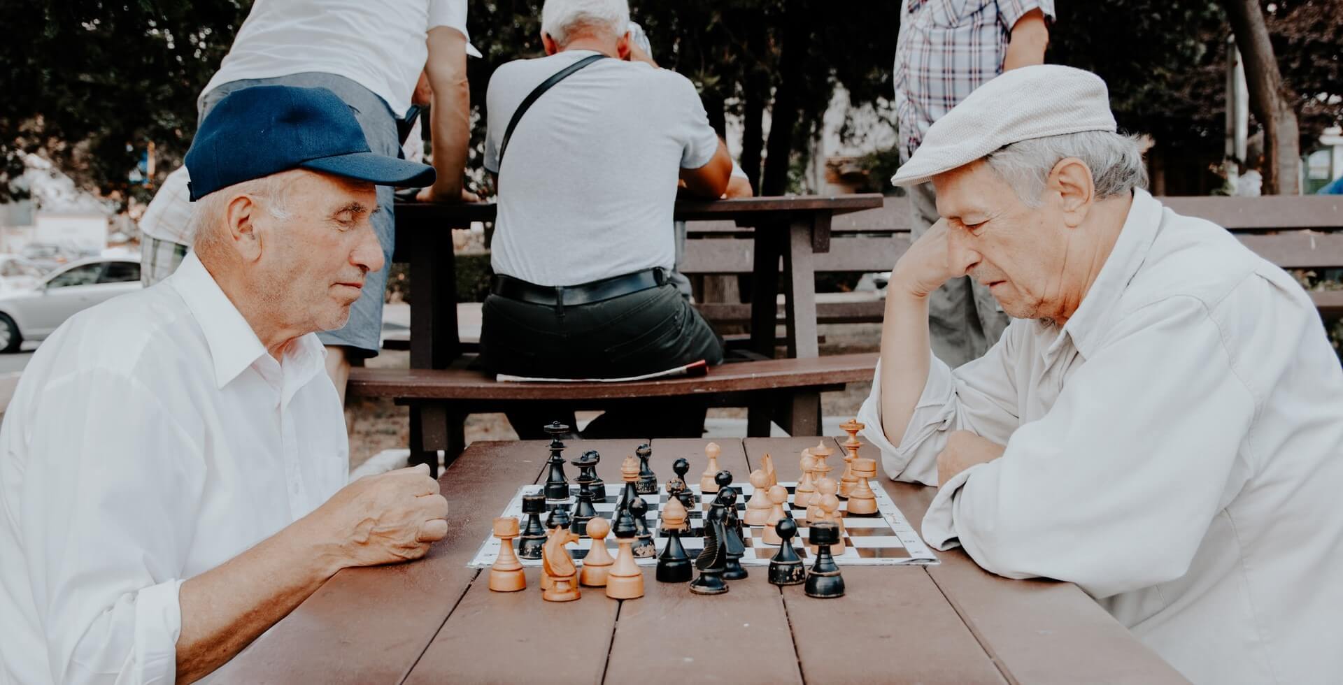 two seniors playing chess