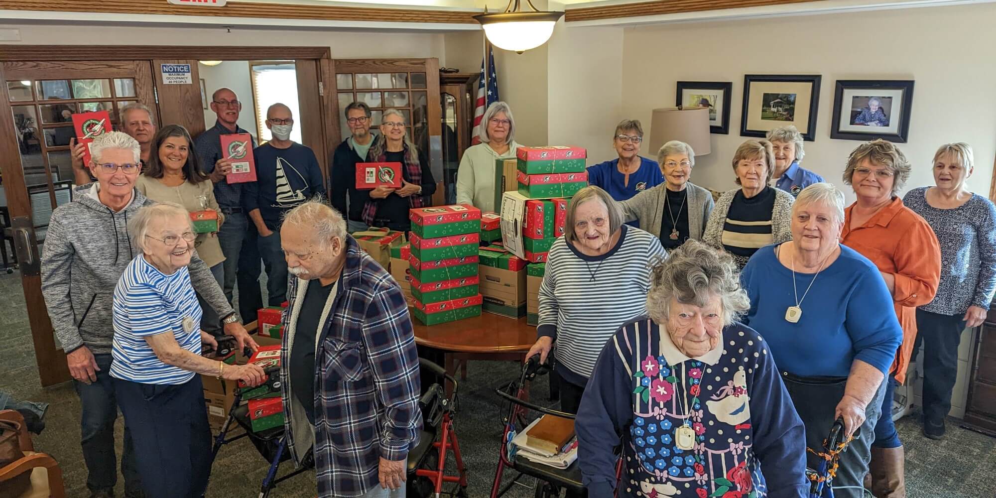 Christian Haven residents showing off all the boxes they packed for Operation Christmas Child