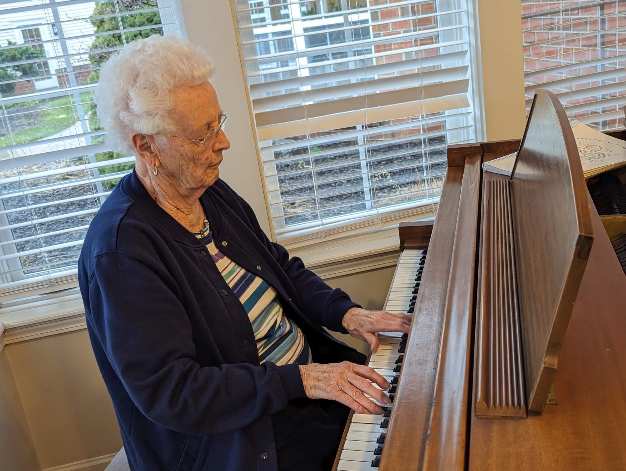 elderly woman playing piano