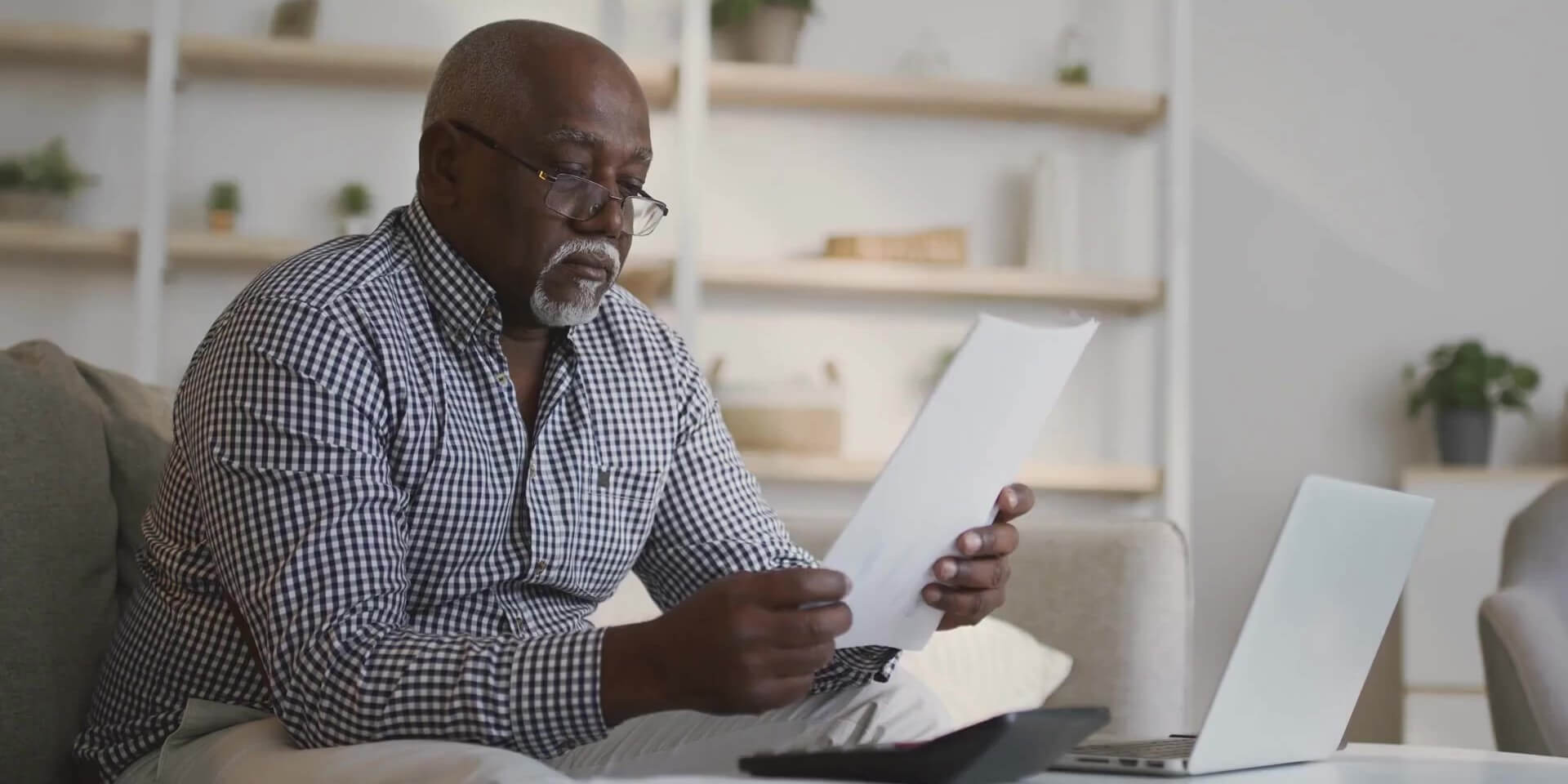 Older gentleman looking at documents