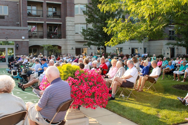 Waterford Place residents enjoying a concert on the lawn